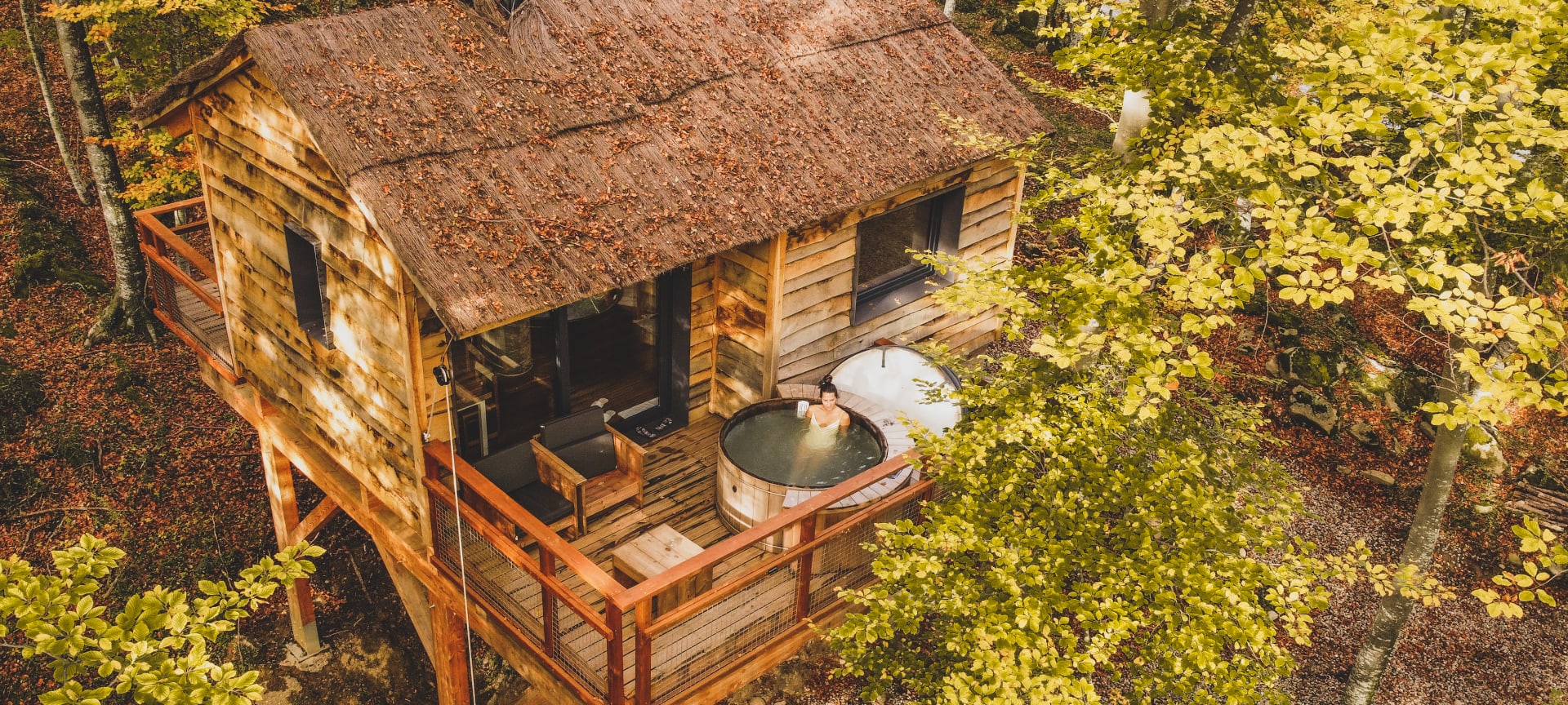 Tourist relaxing in a jacuzzi at a cabin in the Vall de Bianya in Girona, Catalonia Tourist relaxing in a jacuzzi at a cabin in the Vall de Bianya in Girona, Catalonia