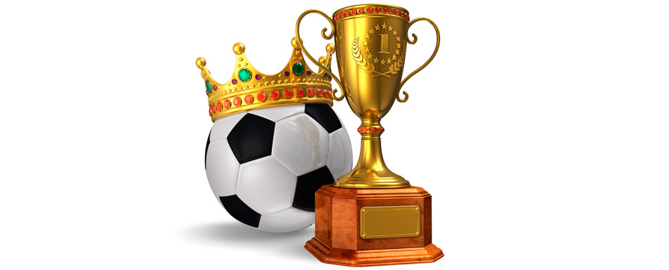 Winner's trophy and football with a crown