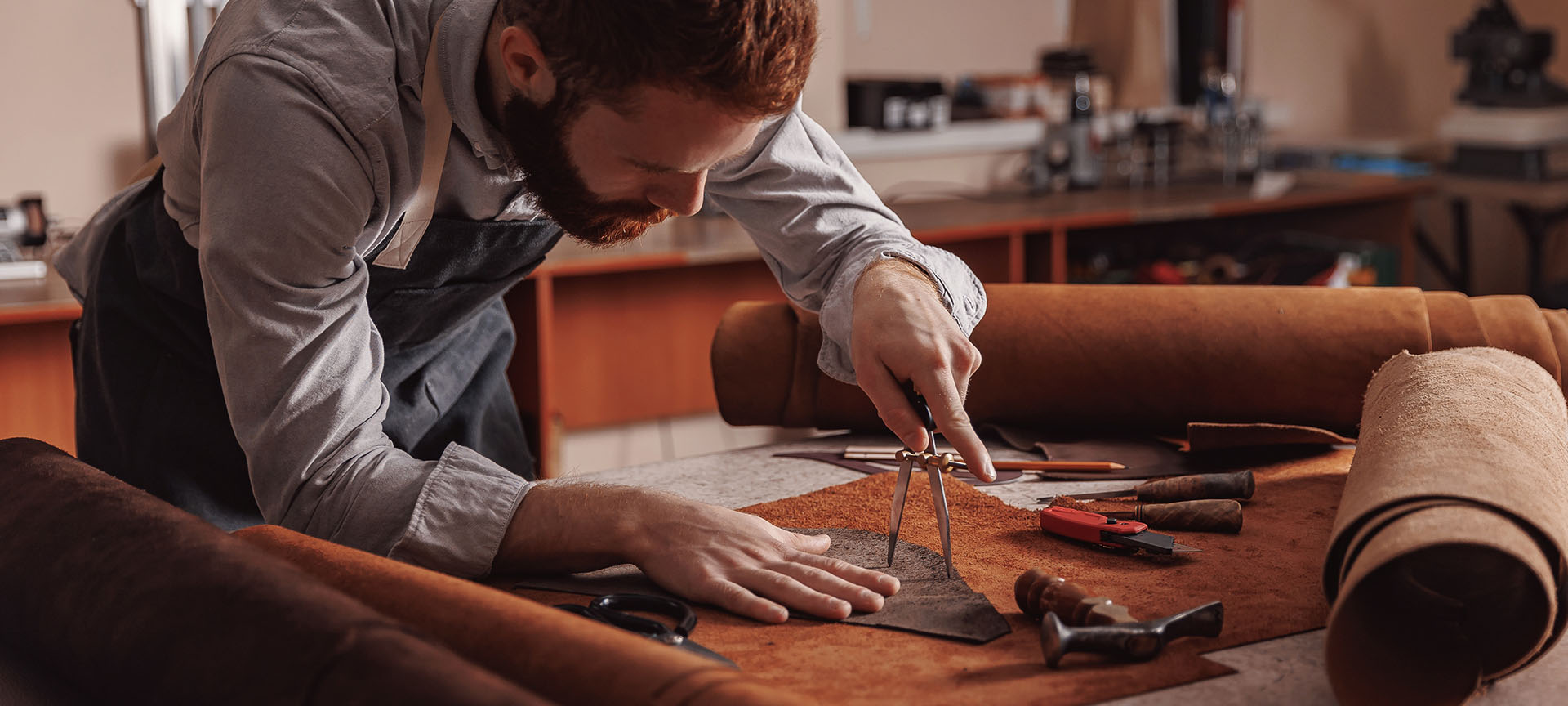 Craftsman working with leather