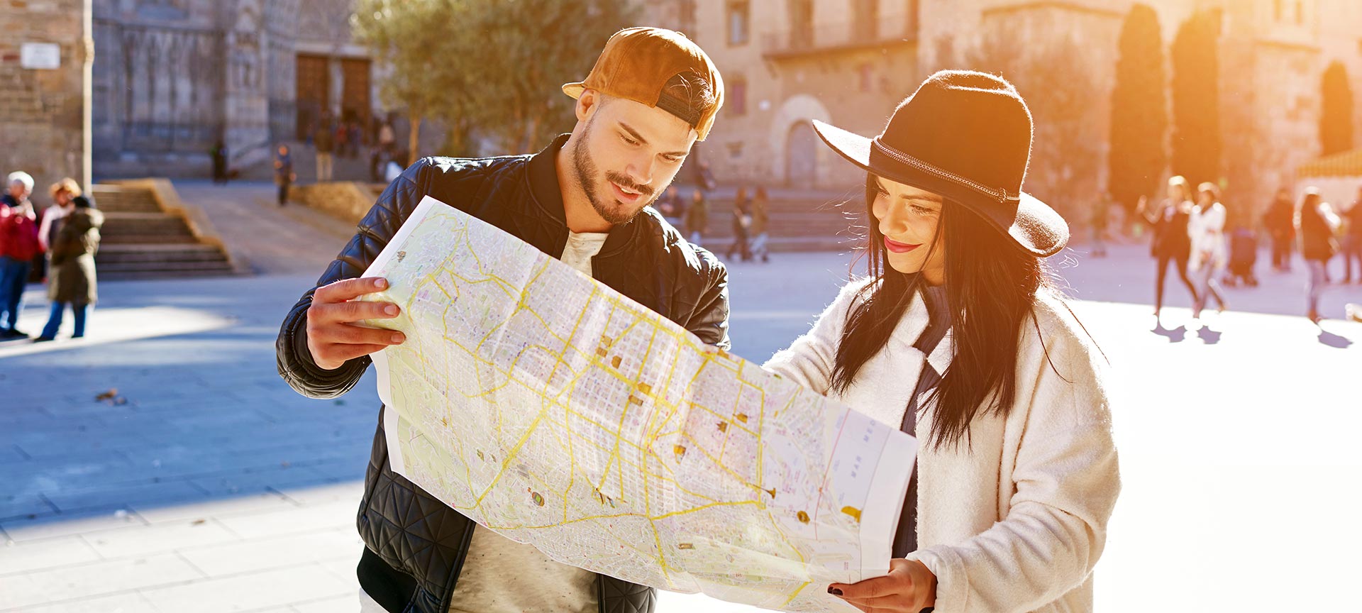 Young couple looking at a map in Barcelona