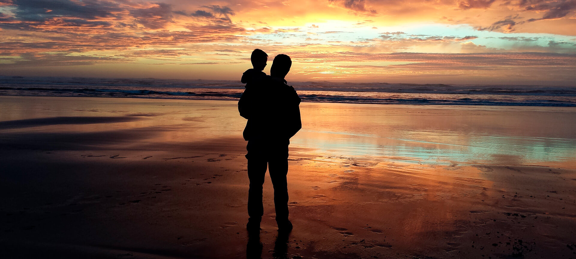 Parent and child at the beach