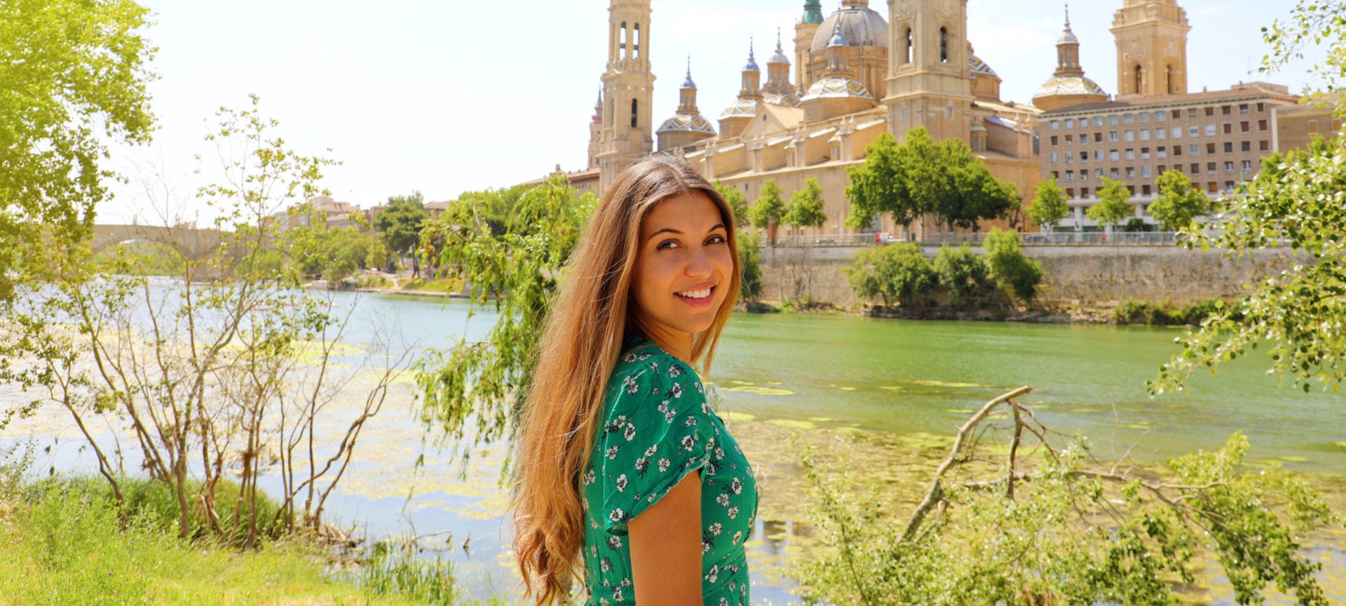 Tourist as the Ebro river goes through the city of Zaragoza, Aragon