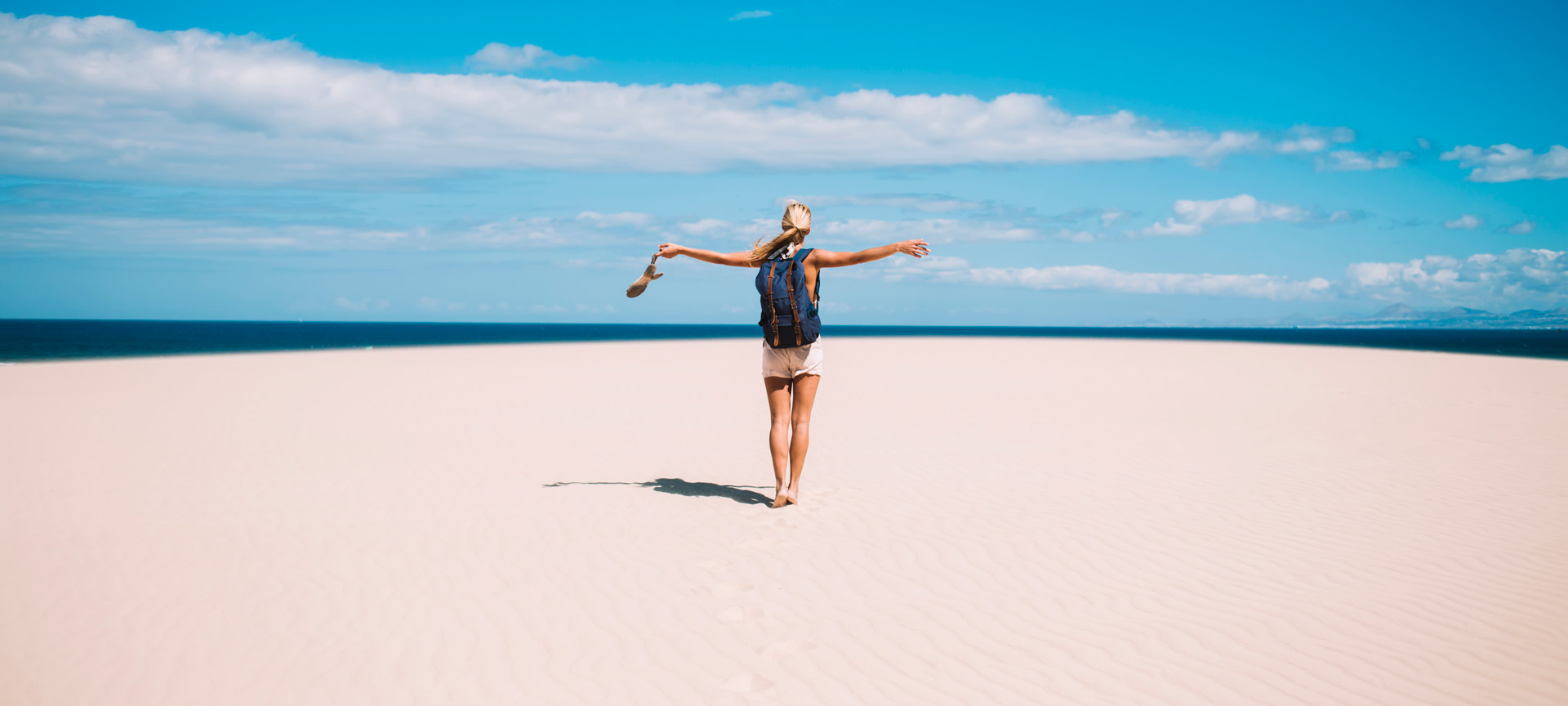 Tourist walking along the beach