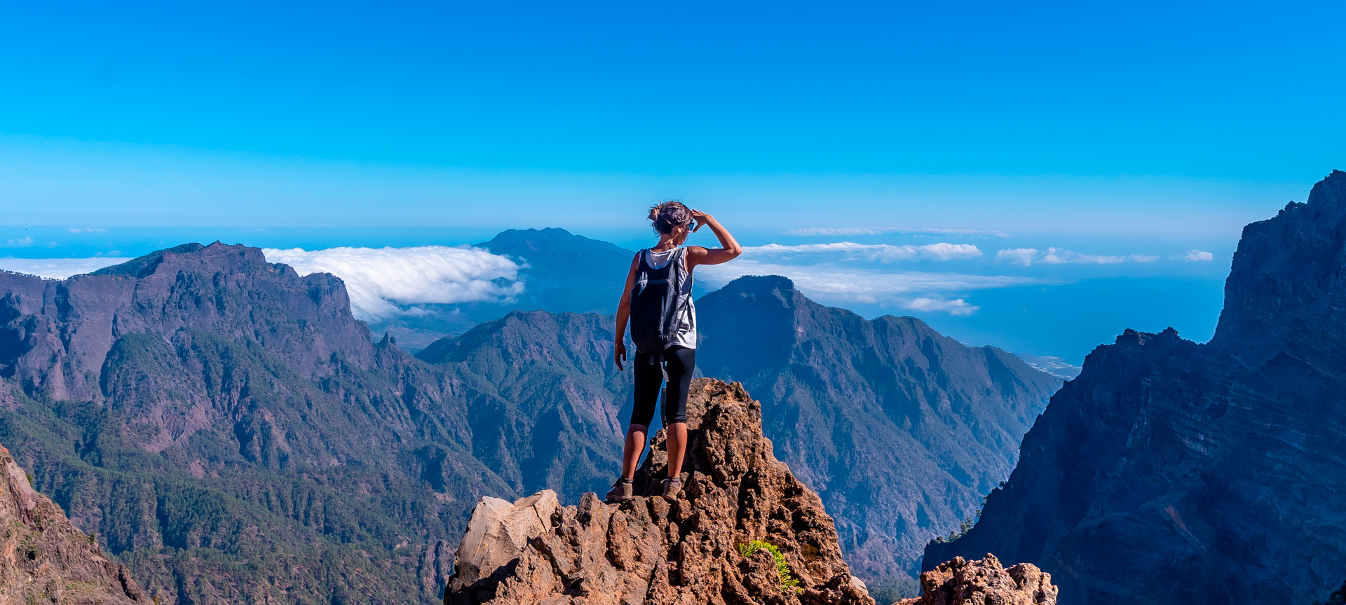 Tourist looking at the view in the Caldera de Taburiente Nature Reserve on La Palma, Canary Islands Tourist looking at the view in the Caldera de Taburiente Nature Reserve on La Palma, Canary Islands