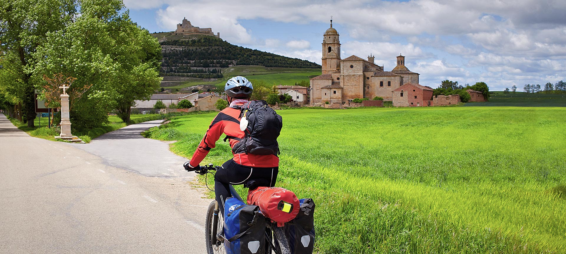 Pilgrim on bicycle on their way through Castrojeriz. Burgos