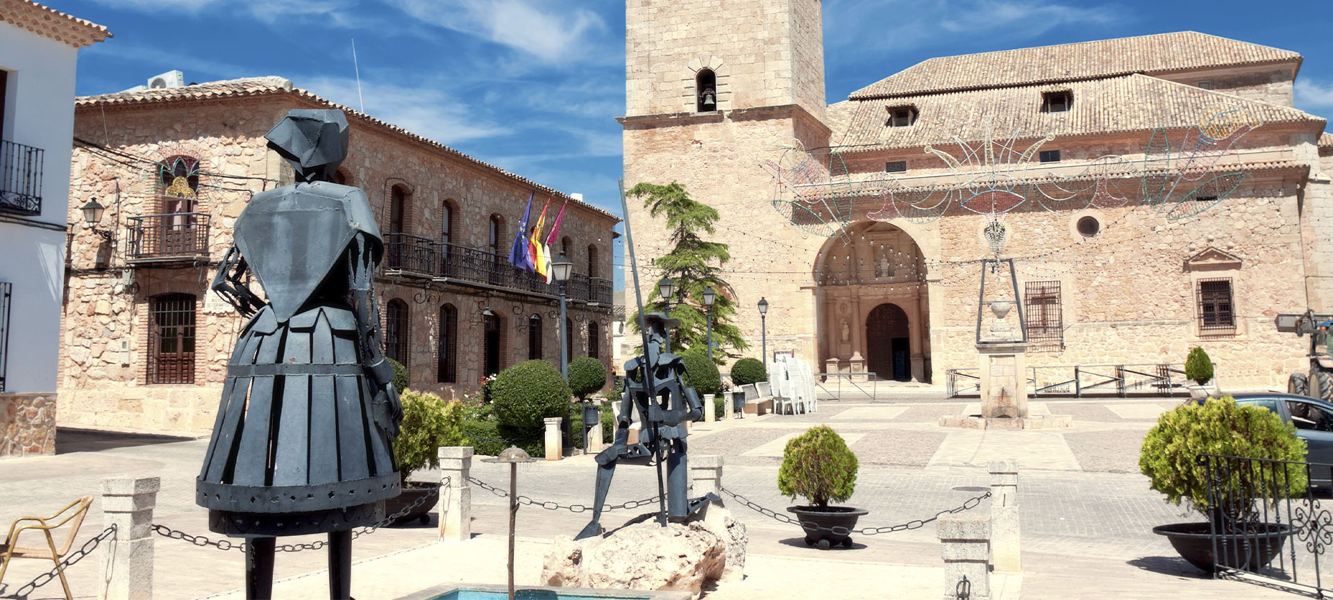 Statues of Don Quixote and Dulcinea in front of the Church of San Antonio Abad in El Toboso (Toledo, Castilla-La Mancha)