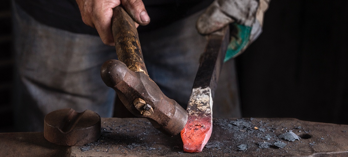 Craftsman working on a sword in a workshop in Toledo. Craftsman working on a sword in a workshop in Toledo.