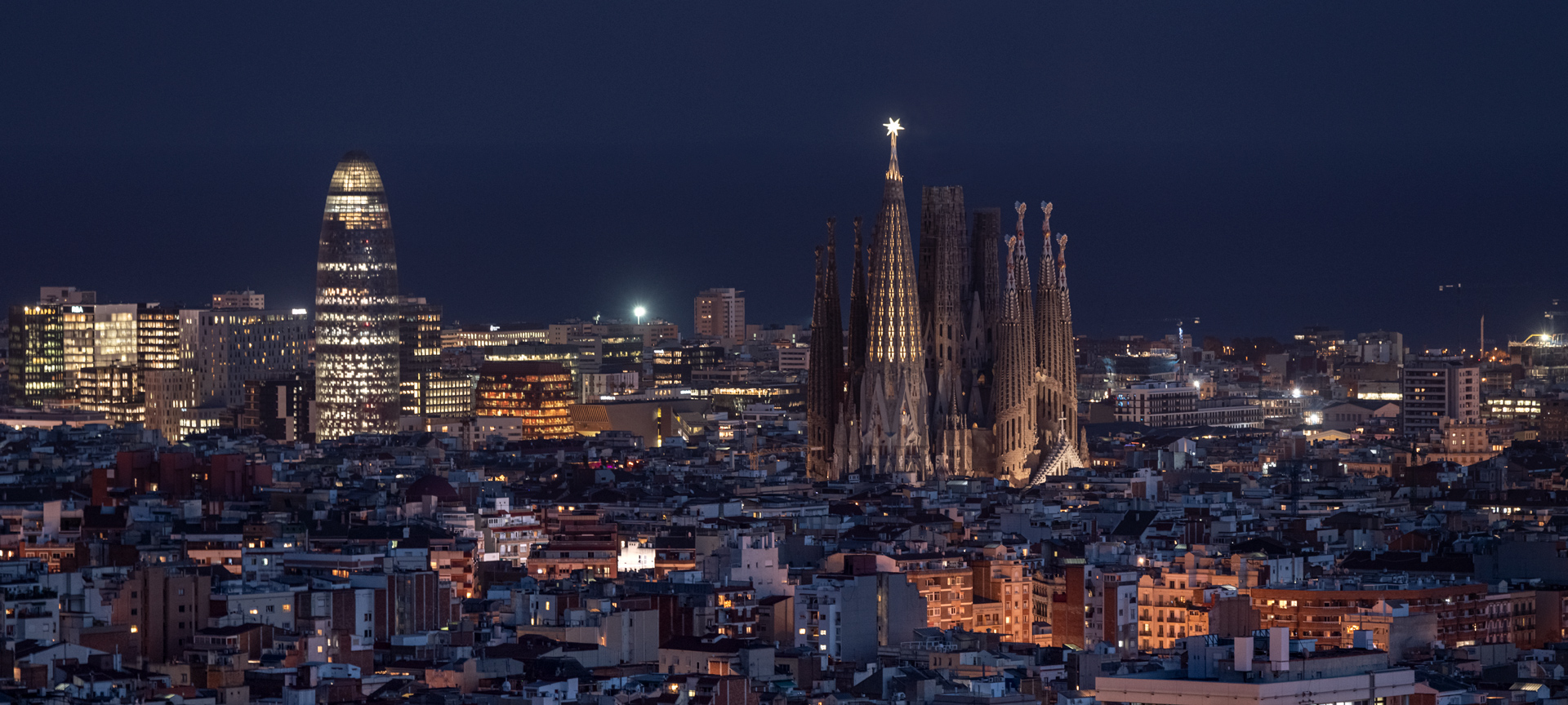 Night view of the Sagrada Familia and the Glòries Tower in Barcelona, Catalonia