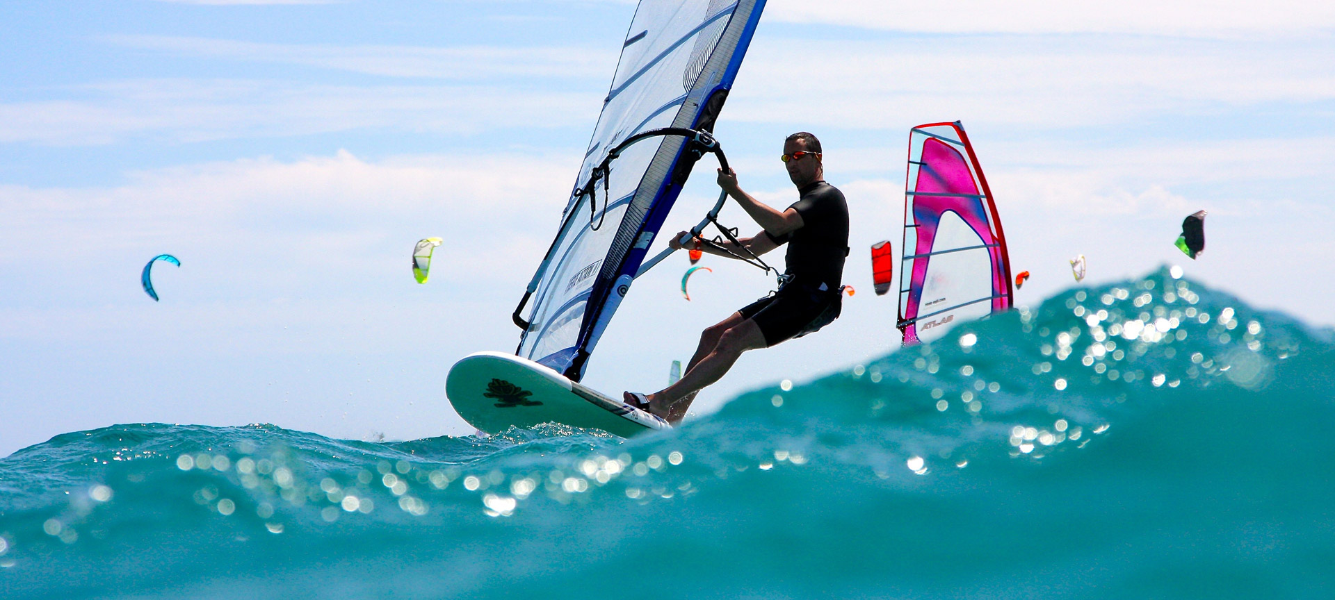 A windsurfer riding a wave.