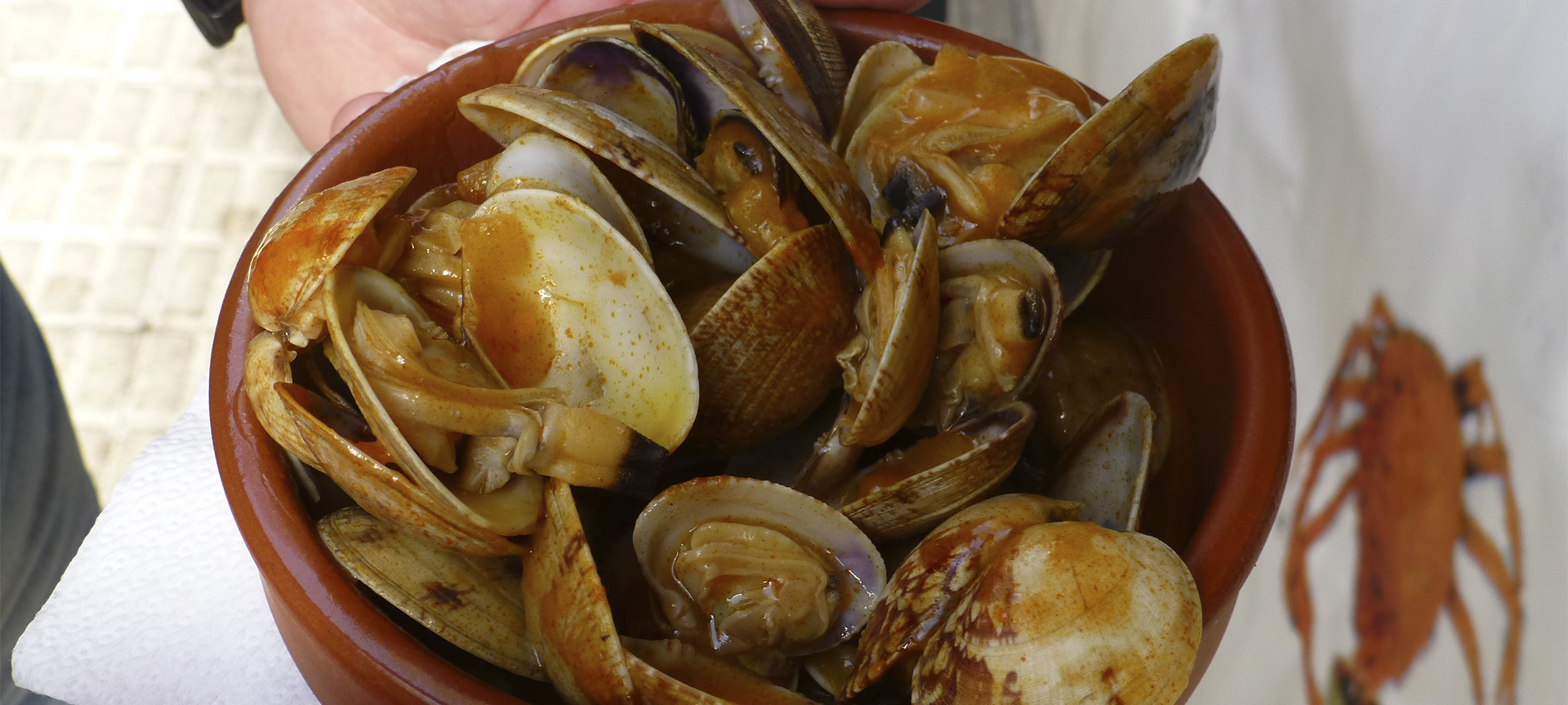 Cazuela de almejas (clam casserole), one of the traditional dishes at the Seafood Festival in O Grove (Pontevedra, Galicia)