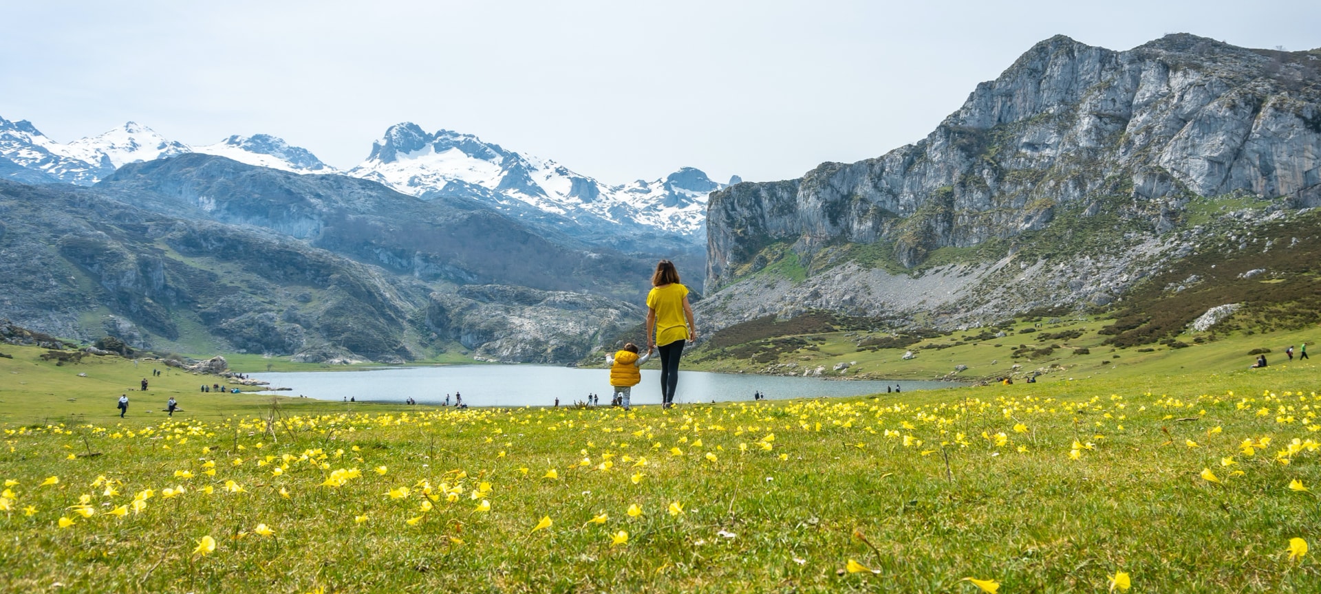 Tourists admiring Lake Ercina in the Picos de Europa National Park, Asturias