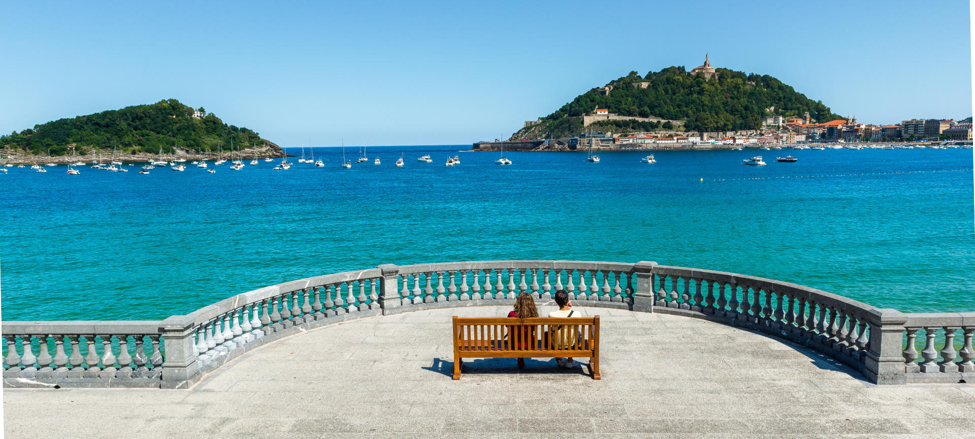 Young people gazing at the sea in San Sebastián, Basque Country.