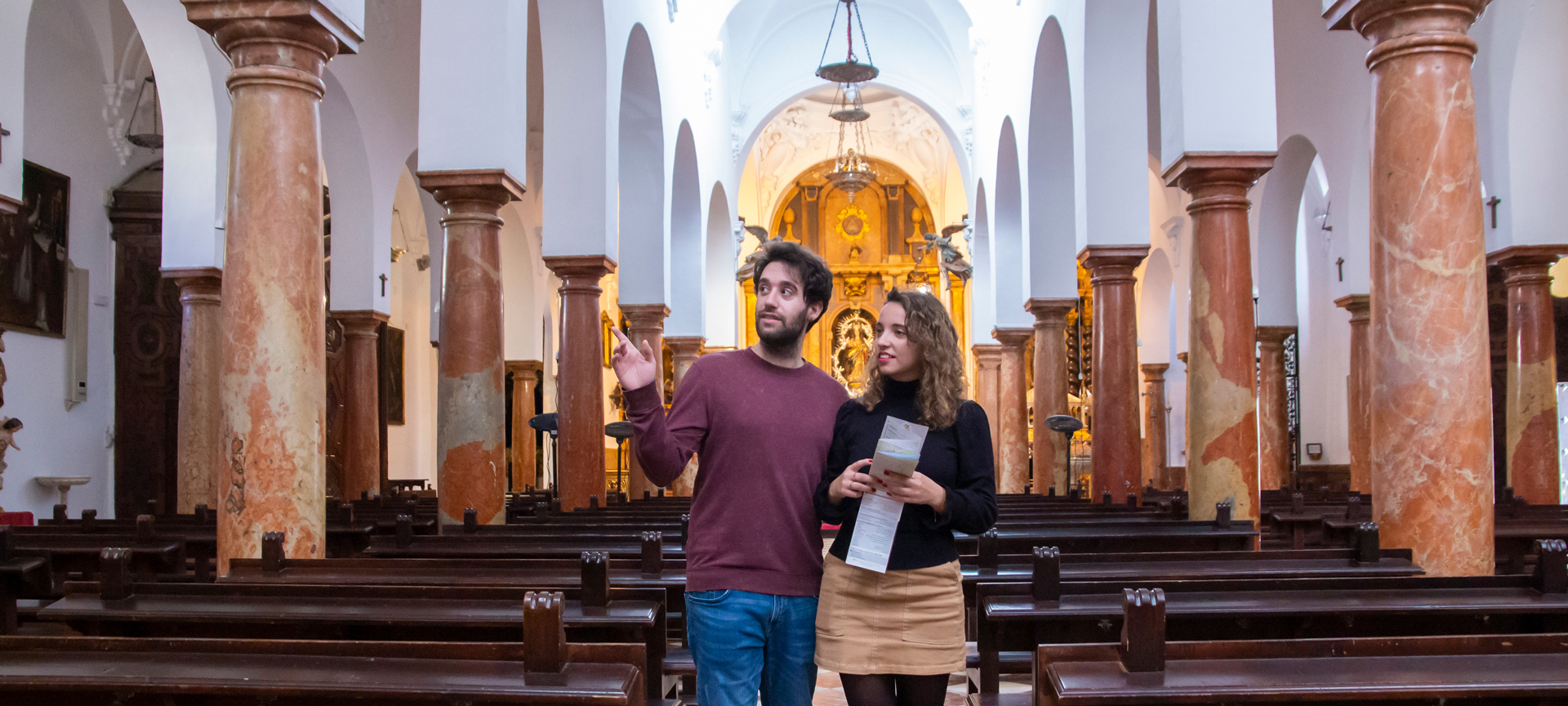 Tourists visiting the church of Asunción y Ángeles de Cabra in Córdoba, Andalusia