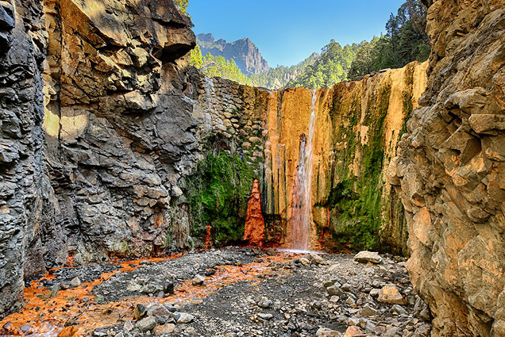 Rainbow colours of the Cascada de Colores in the Caldera de Taburiente National Park on the Island of La Palma, Canary Islands