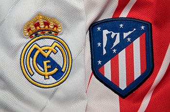 Crests of Real Madrid and Atlético de Madrid