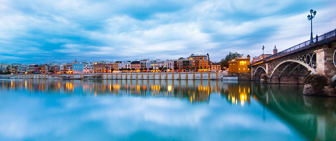Triana bridge and Calle Betis in Seville. Andalusia Triana bridge and Calle Betis in Seville. Andalusia