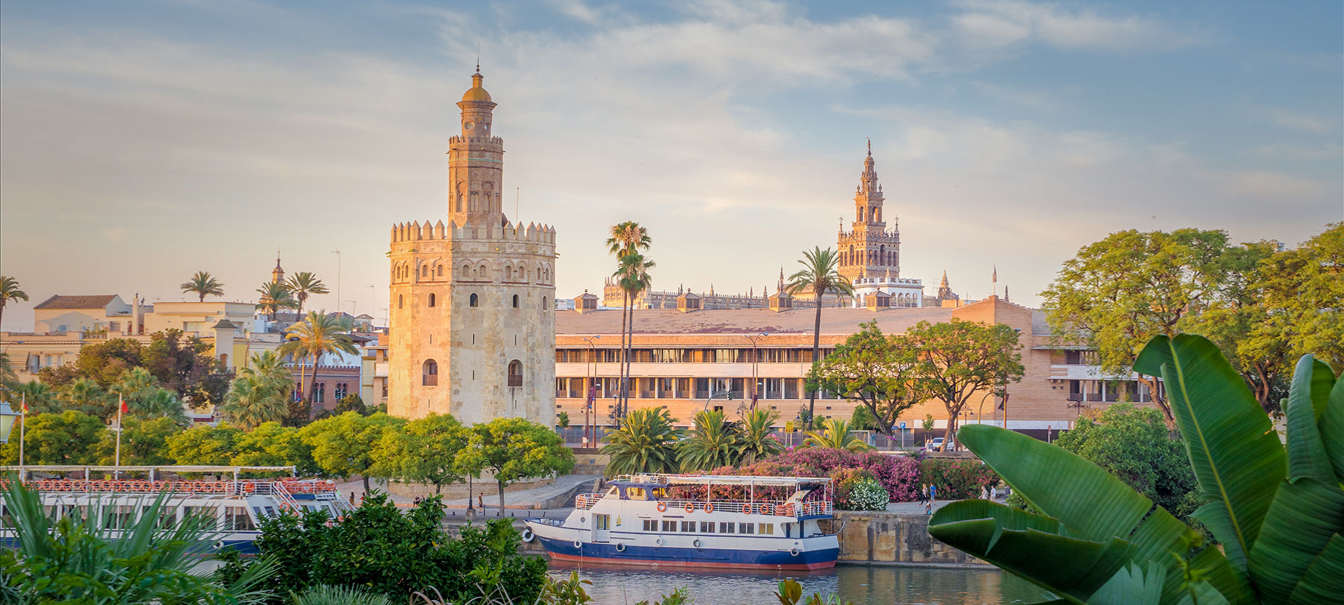 The Torre del Oro with the Giralda in the background, in Seville, Andalusia The Torre del Oro with the Giralda in the background, in Seville, Andalusia