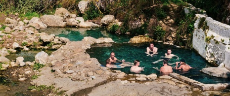 Tourists enjoying the thermal baths on the River Alhama in Granada Tourists enjoying the thermal baths on the River Alhama in Granada