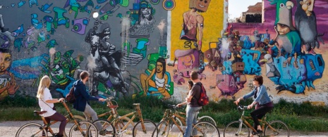 Tourists on an eco-bike street art tour of Barcelona, Catalonia Tourists on an eco-bike street art tour of Barcelona, Catalonia