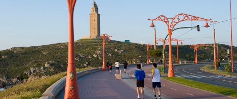 People running and walking along the seaside promenade in A Coruña People running and walking along the seaside promenade in A Coruña