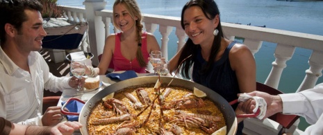 Friends eating paella Friends eating paella