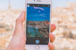 Person taking a photo of Toledo on their phone