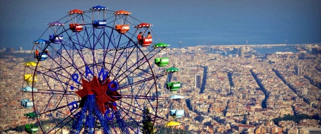 Tibidabo ferris wheel with Barcelona in the background Tibidabo ferris wheel with Barcelona in the background
